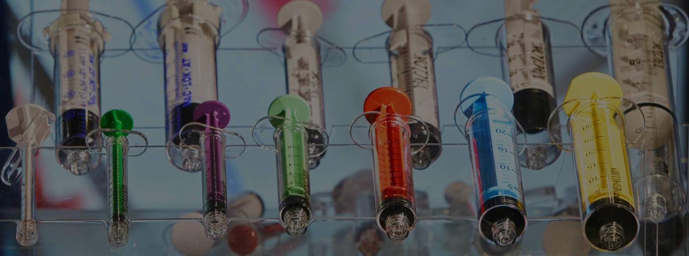 A collection of colorful needles arranged neatly on a surface, showcasing various hues and styles