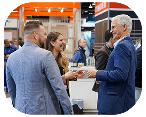 Several individuals interacting and conversing at an event, creating a lively and engaging atmosphere