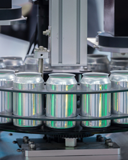 A beer canning machine is efficiently filling and sealing cans in a brewery environment