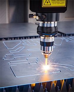 A laser cutting machine operates, precisely cutting through a sheet of metal in a workshop setting
