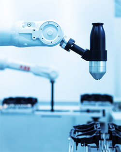 1. Robotic arm assembling parts in a factory setting, showcasing automation in manufacturing processes