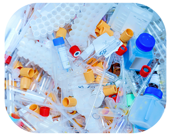 A disorganized pile of various plastic bottles and tubes stacked together