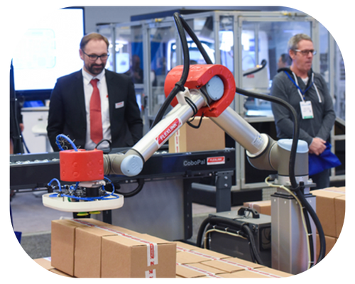  man wearing a suit and tie poses next to a robot, representing a futuristic collaboration between humans and machines