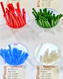 A collection of plastic tubes in various colors arranged neatly for display