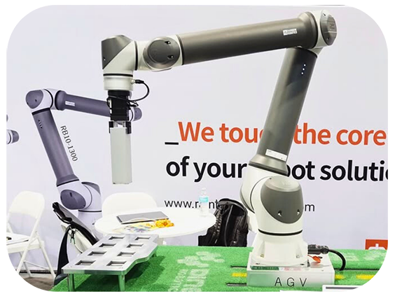 A robot stands on display at an event, showcasing its design and technology to attendees