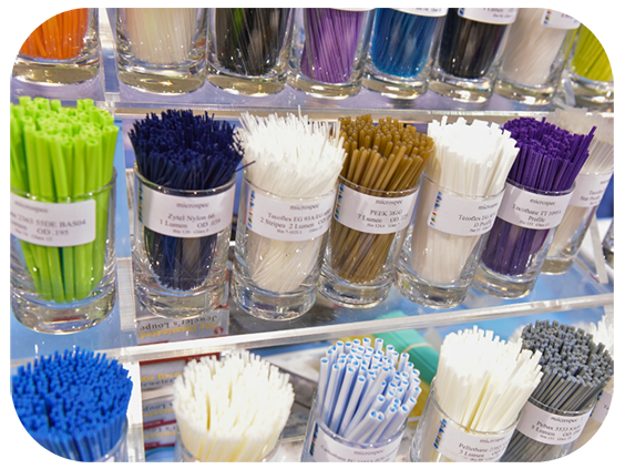 A variety of plastics in different colors displayed together on a surface